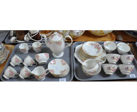 Two trays of part teaware, one of Spencer Stevenson bone china 'Poppy' pattern comprising six teacups and saucers, six side p