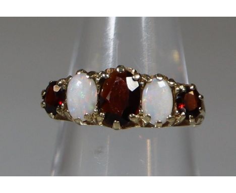 Victorian design 9ct gold opal and garnet dress ring. 3g approx. (B.P. 21% + VAT) Size K 1/2