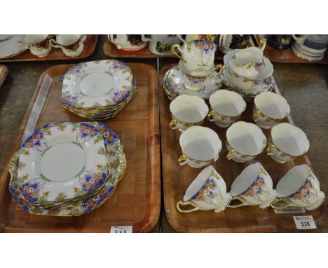 Two trays of New Chelsea fine bone china part tea set in 'Woodlands' pattern comprising: eleven cups, twelve saucers, twelve 