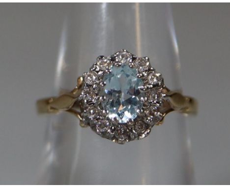 9ct gold step set aquamarine and diamond chip dress ring. 3g approx. (B.P. 21% + VAT)Size M 