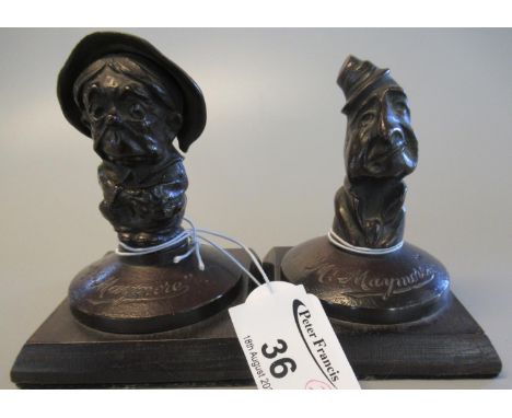 Pair of patinated bronze paperweight figures in the form of Dickensian characters, Mr & Mrs Maymore, on square oak bases. 10c