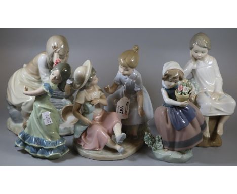 Three Lladro Spanish porcelain figurines to include girl with pot of flowers, together with a Nao figure group, and another N