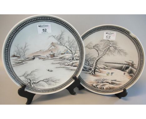 Pair of modern Chinese enamel decorated plates depicting figures in winter scenes, blue seal marks to bases. 25cm diameter ap