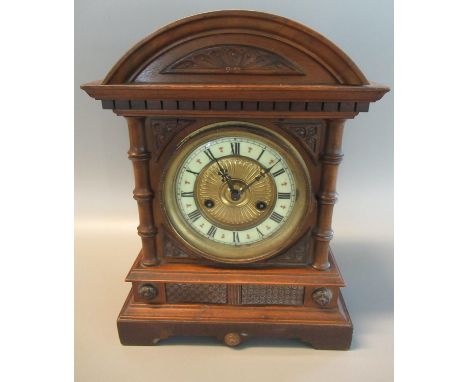 Early 20th Century German two train wooden architectural mantel clock with ceramic Roman chapter ring, 37cm high approx. (B.P
