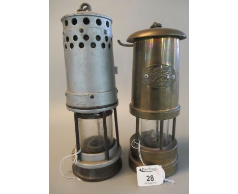 A reproduction Welsh brass miner's safety lamp, together with a vintage aluminium miner's safety lamp. (2)(B.P. 21% + VAT) Th