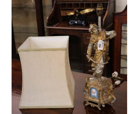 French spelter figural lamp base in the form of a Moorish figure with sword and pistol, on an ornate base with inset French p