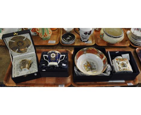 Four ornately decorated commemorative pieces, all in the original boxes. One Royal bone china 'Royal White' china cup and sau