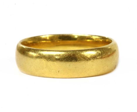 A 22ct gold light court section wedding ring, Birmingham, 6.55g.Finger size OCondition report: Surface marks/scratches.Slight