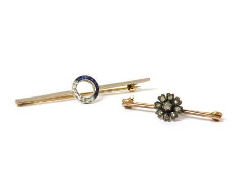 A diamond and sapphire bar brooch, an openwork circle grain set to one half with old eight cut diamonds and channel set the o