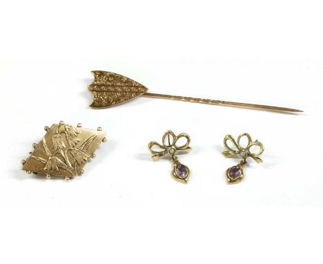 A gold shield form stick pin, with hand engraving, tested as approximately 9ct gold, together with a Victorian 9ct gold lozen