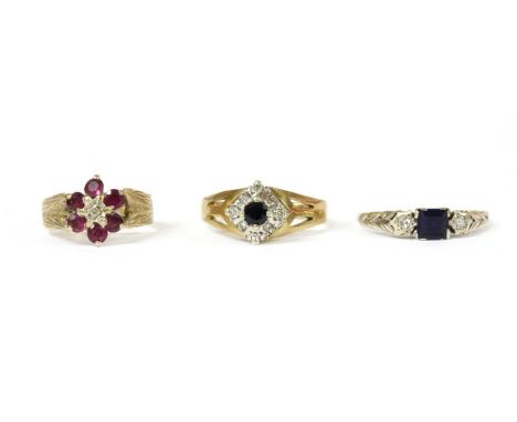 A 9ct gold sapphire and diamond cluster ring, London 1975, together with a 9ct gold diamond and ruby cluster ring, London 197