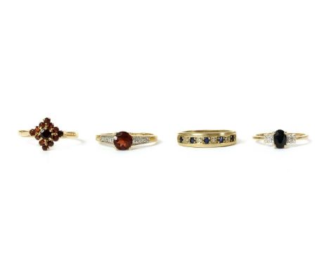 Four 9ct gold rings, to include a garnet cluster ring, London 1976, a sapphire and diamond three stone ring, London, a sapphi