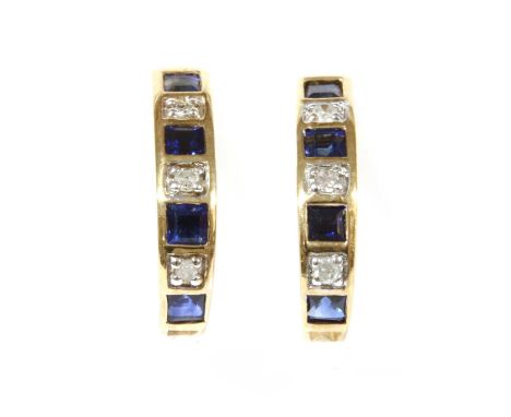 A pair of gold sapphire and diamond 'J' hoop earrings, with alternating square step cut sapphires and eight cut diamonds, rub