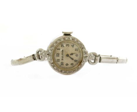 An American platinum Bulova diamond set cocktail watch, circular case, 18mm diameter, with silvered dial, Arabic numerals and