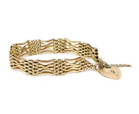 A 9ct gold five row gate bracelet, with straight central bars to outer bowed bars, with heart shaped padlock clasp and safety