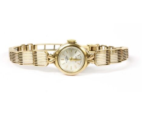 A ladies' 9ct gold Rotary mechanical bracelet watch, 16mm diameter, with a silvered dial and baton hour markers, to integral 