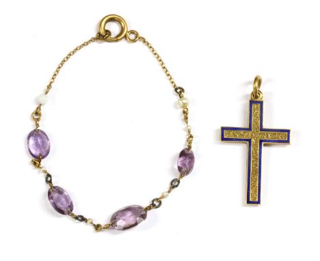 A gold enamel Latin cross pendant, central chased decoration, to royal blue enamel border, with jump ring, tested as approxim