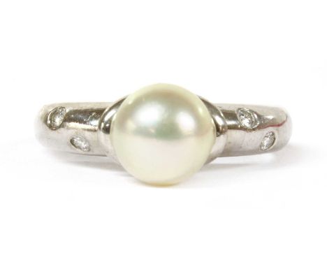 A white gold cultured pearl and diamond ring, by Mikimoto, a cultured pearl, 7.5 to 7.6mm in size, cup set, to tapered should