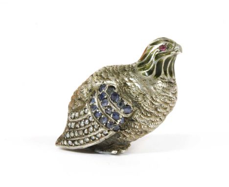A silver sculpture of a partridge, probably from a larger piece, with cabochon ruby set eyes, green enamel to the neck, and w