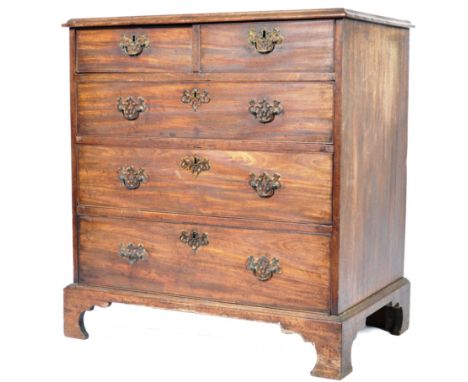 An early 19th Century English Georgian bachelors mahogany chest of drawers having brass armorial batwing back plates with dro