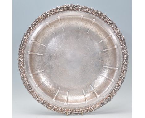 A large vintage 20th Century silverplate tray by&nbsp;Barker Ellis having a finely engraved scroll decoration with a floral m