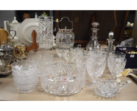 An assortment of glassware consisting mainly of cut glass comprising goblets, decanters, biscuit caddy and a lead crystal fru