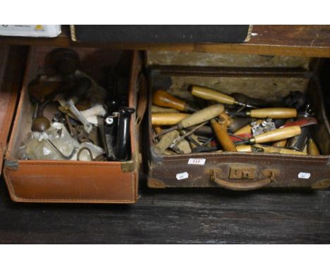 Two leather cases containing vintage hand tools, including a Stanley planer, chisels, and files