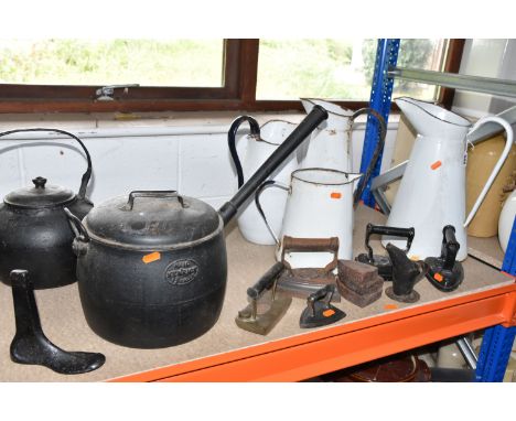 A QUANTITY OF CAST IRON CAULDRONS, IRONS AND ENAMEL PITCHERS, comprising four large white enamelled pitchers, two large ename