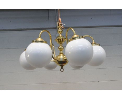 A BRASS SIX BRANCH CHANDELIER, with globe glass shades, approximate diameter 76cm x approximate height 50cm (condition report