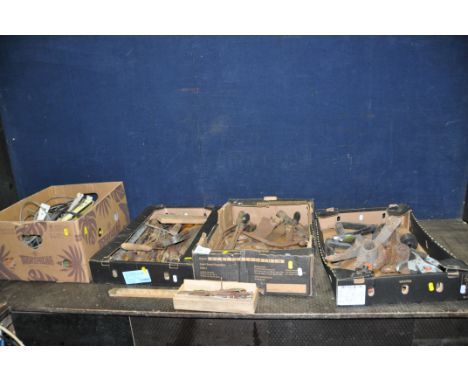 FOUR TRAYS CONTAINING VINTAGE TOOLS including thread gauges, tap holders, pick axe heads, secateurs, saws, a Chesterman joine