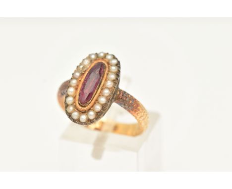 A MID VICTORIAN CLUSTER RING, set with an elongated oval shape faceted red paste, within a seed pearl surround, to the textur