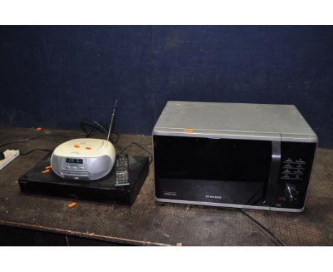 A SONY RDR-DC205 DVD RECORDER WITH REMOTE, a Samsung microwave and an Azatom portable Hi Fi, a Black and Decker hedge trimmer