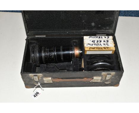 A BOXED VINTAGE ANGENIEUX CAMERA LENS a zoom type 10 x 12 b No. 1152297 1:2.2 with five Leech coloured filters and attachment