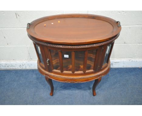 A LATE 20TH CENTURY MAHOGANY DRINKS CABINET, with a removable tray, a single door, raised on cabriole legs, width 74cm x dept