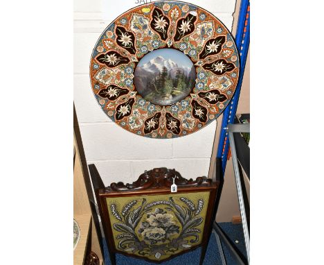A LATE 19TH CENTURY THOUNE EARTHENWARE MAJOLICA CHARGER, decorated with a hand painted Swiss alpine mountain scene and floral