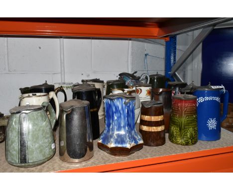 A GROUP OF LATE NINETEENTH-EARLY TWENTIETH CENTURY CERAMIC PITCHERS comprising twenty-one pitchers with pewter lids in variou
