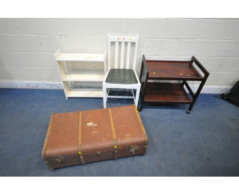 A VINTAGE CANVASS TRAVELING TRUNK, with wooden banding, a two tier trolley, a chair and a small bookcase (condition report: a