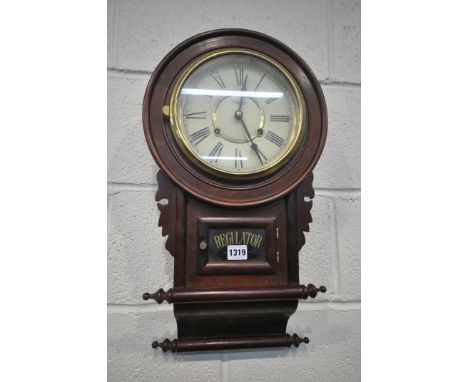 A 20TH CENTURY REGULATOR WALL CLOCK, the circular glass door enclosing a 7.5 inch enamel dial, depicting Roman numerals, read