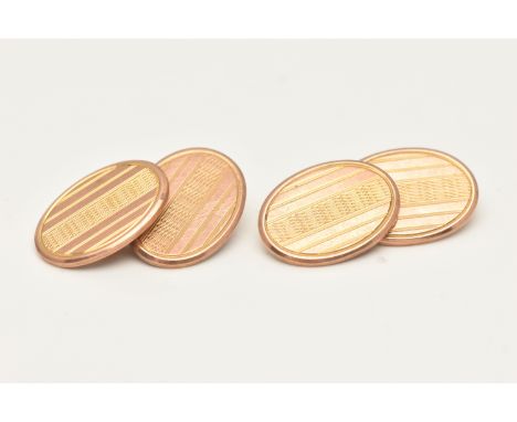 A PAIR OF 1920S 9CT YELLOW GOLD CUFFLINKS, each designed as two oval shape links, with engine turned detail connected by a ch