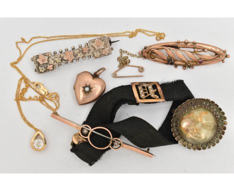 AN ASSORTMENT OF LATE 19TH AND EARLY 20TH CENTURY JEWELLERY, to include a fabric bracelet with a yellow metal and seed pearl 