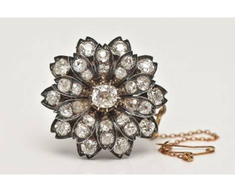 A LATE VICTORIAN DIAMOND FLORAL BROOCH, set with a principal cushion-shape old-cut diamond, measuring approximately 6.22mm by