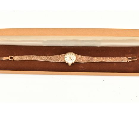 A ZENITH 9CT GOLD WRISTWATCH, the silver colour diamond, with gilt black enamel hourly applied markers, gilt black hands, dia