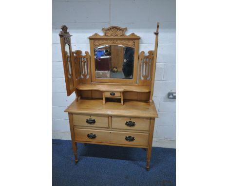 AN EDWARDIAN SATINWOOD DRESSING TABLE, with a triple bevelled edge mirror, atop a base with two short over a single long draw