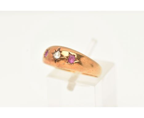 A LATE VICTORIAN 15CT GOLD DIAMOND AND RUBY THREE STONE RING, set with a rose cut diamond and two cushion cut, hallmarked 15c