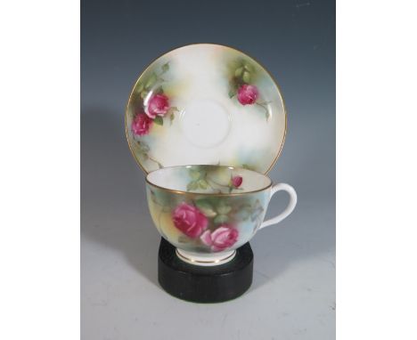 A Royal Worcester Rose Decorated Tea Cup and Saucer