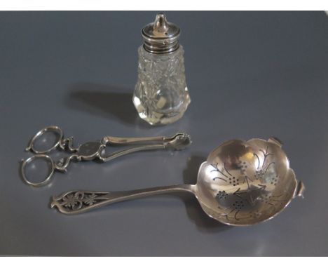 A Pair of Georgian Silver Sugar Nips, tea straining spoon and salt