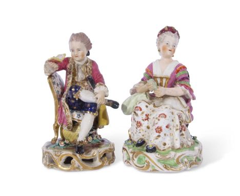 Pair of Derby models of a boy reading, seated on a chair and girl tatting, model nos 311 and 314 respectively (2) (some resto