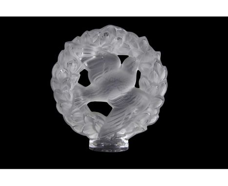 Lalique model of a bird surrounded by floral garland on circular base