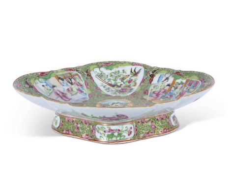 Large Cantonese quatrefoil dish decorated in polychrome with typical panels of Chinese figures interspersed with figures of p