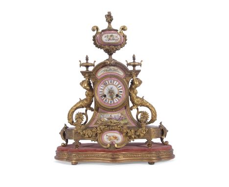 19th century gilt metal and porcelain French mantel clock, the elaborate case with large porcelain urn mount, mermaid side su